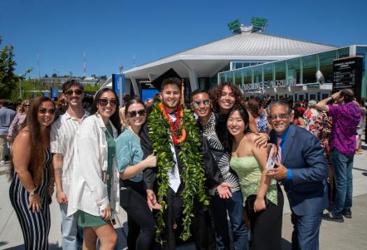 a photo of a student and their family from the UG ceremony