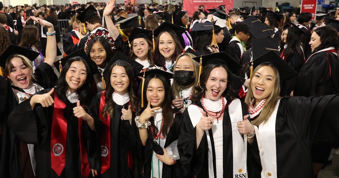 Graduates celebrating together at commencement