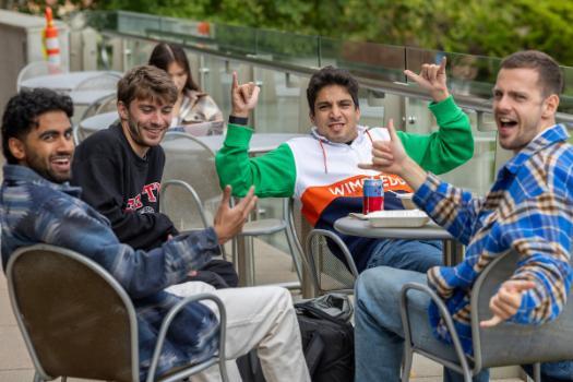 students having fun outside the library on the first day