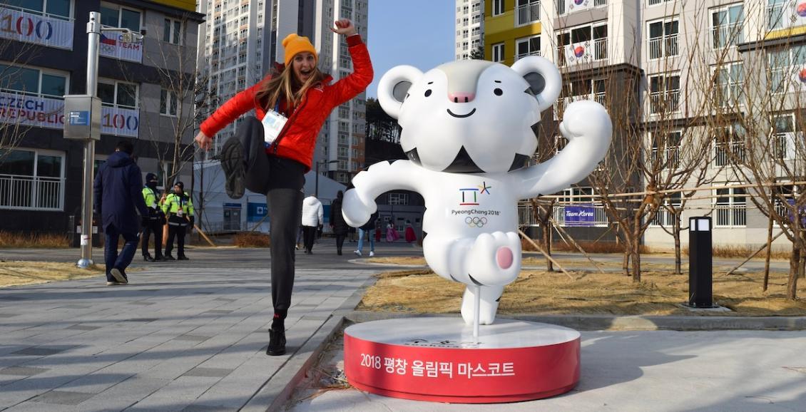 A photo of a former Olympian outside during past Olympics